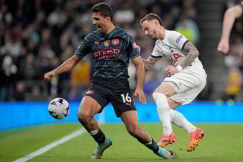 Rodrigo, left, duels for the ball with James Maddison